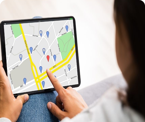 Person using a tablet with map interface
